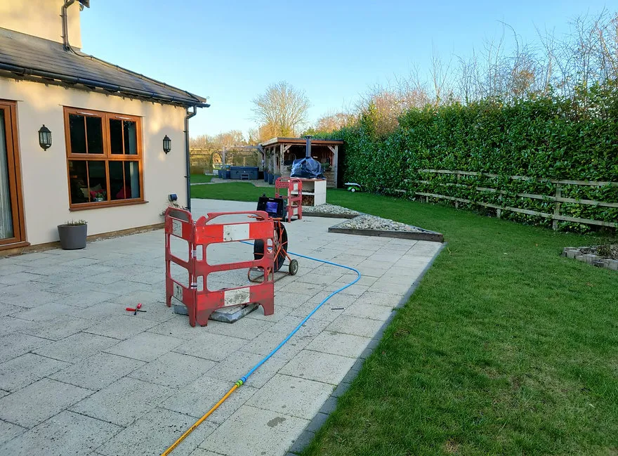 a man is working on a drain clearance
